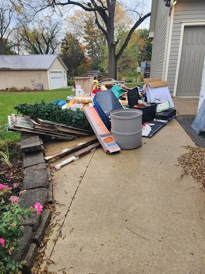 Dumpster being loaded with debris for Roofing Dumpster Rental in Avalon